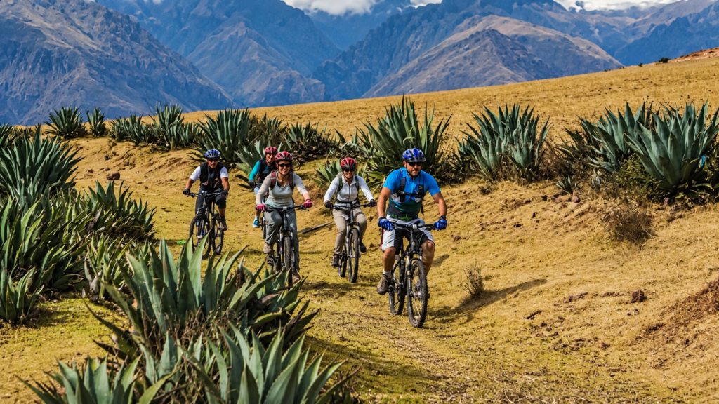 Mountain biker riding the Cusco Death Road through high-Andean scenery